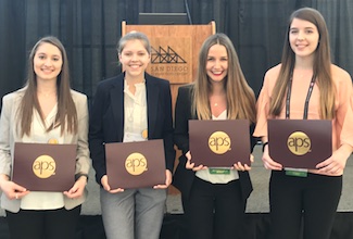 Four undergrads holding awards