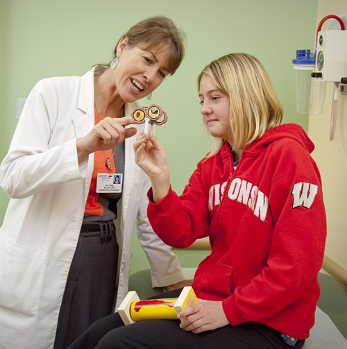 Pediatric nurse practitioner Ann Dodge, PNP, sees a young patient at the Pediatric Preventive Cardiology Clinic.
