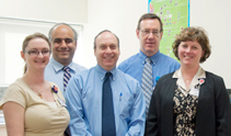 The study team at the bone marrow transplant (BMT) lab, from left: Laboratory Technician Michelle Lindaas, MT (ASCP); BMT Lab Director Peiman Hematti, MD; Kenneth DeSantes, MD; Laboratory Technician Ron Oilschlager, MT (ASCP) SBB; and Clinical Research Associate Jenny Kimball.